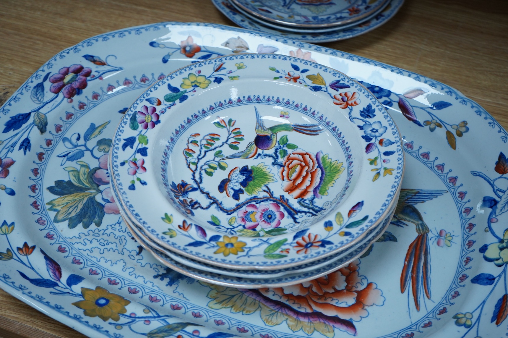 An early 19th century Davenport ironstone part dinner service, eight items, and four matching Stone China dessert dishes, meat plate 50cm